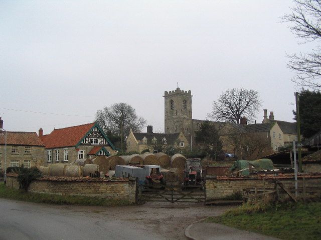 A small village with a church in the background