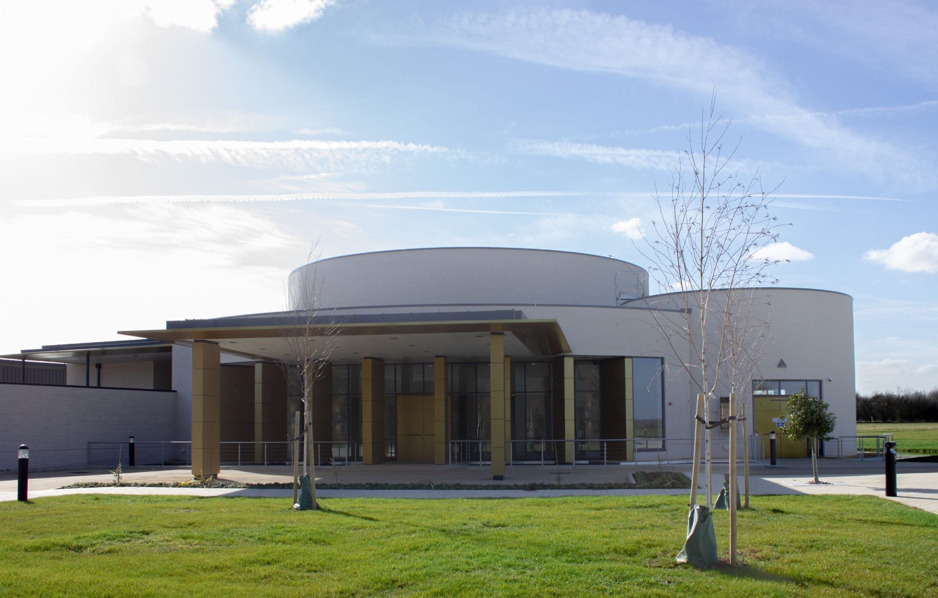 A large white building with trees in front of it
