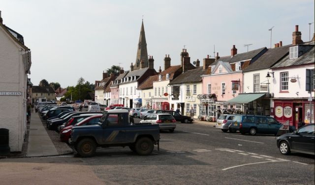 A truck is parked in the middle of a street