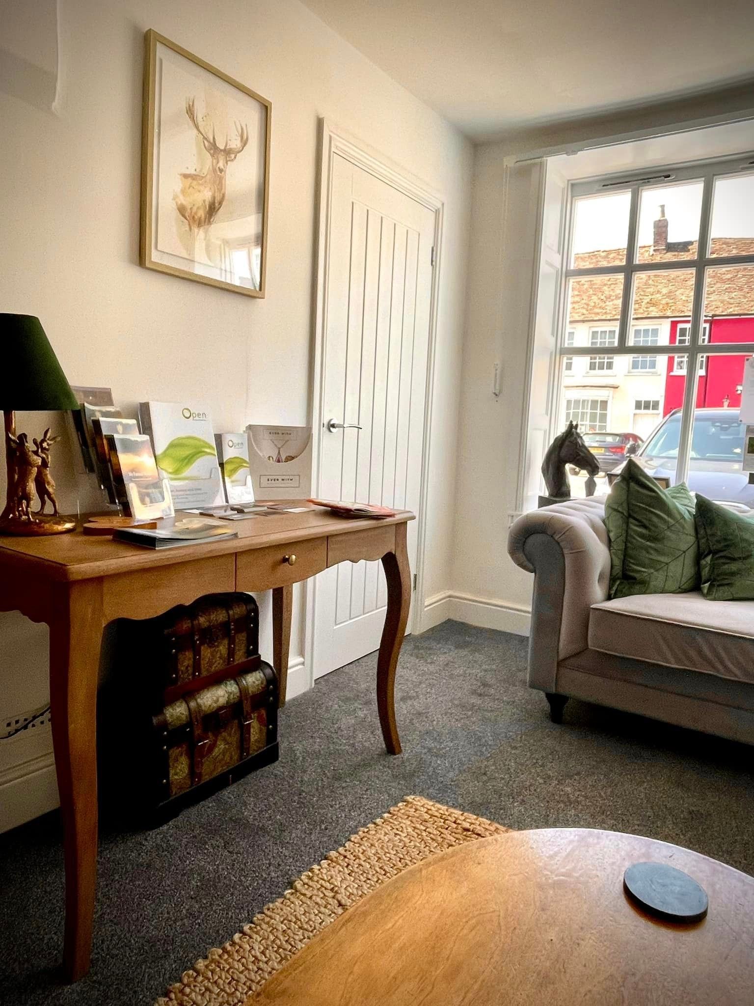 A living room with a couch and a table