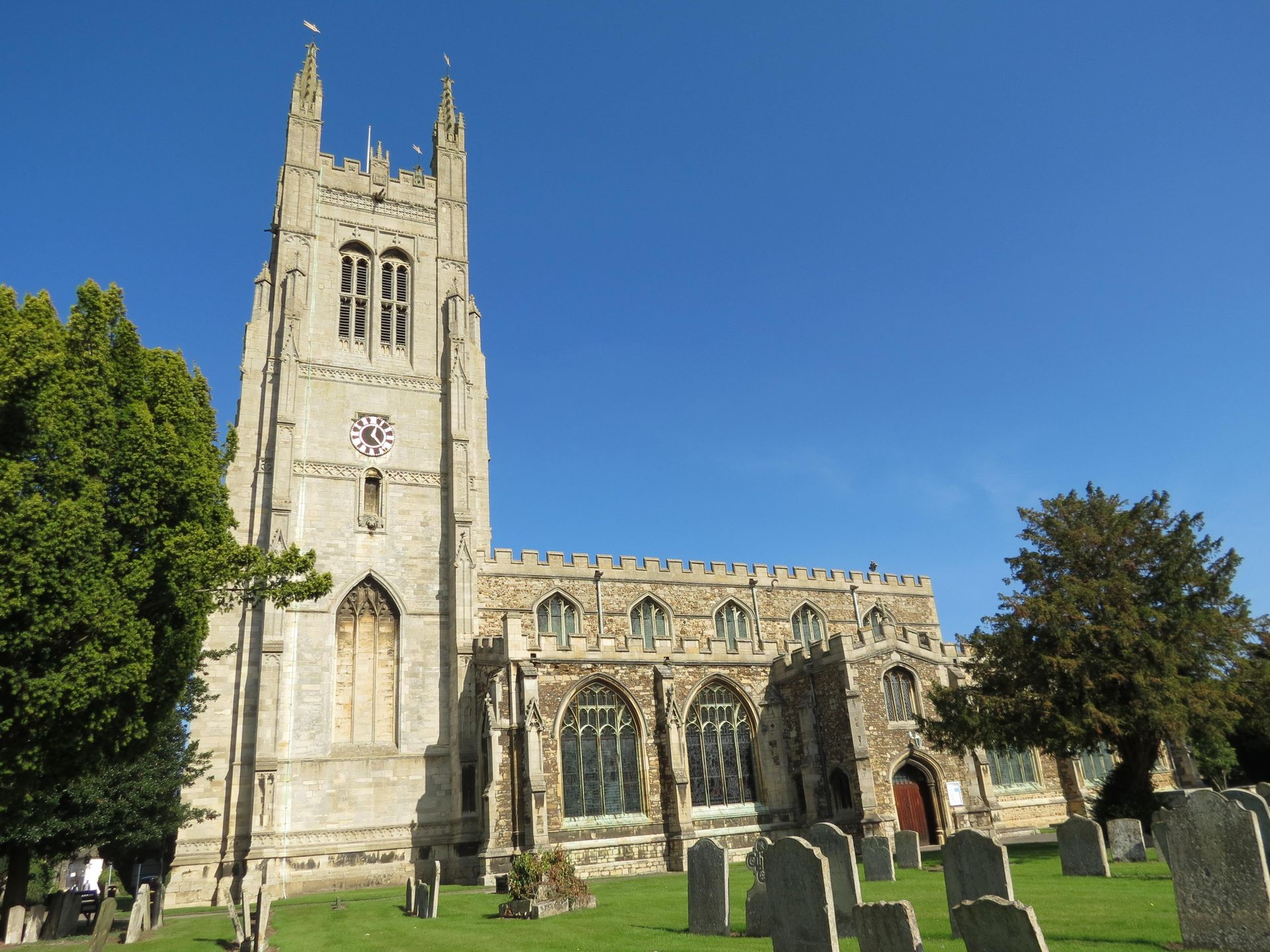 A church with a clock on the top of it