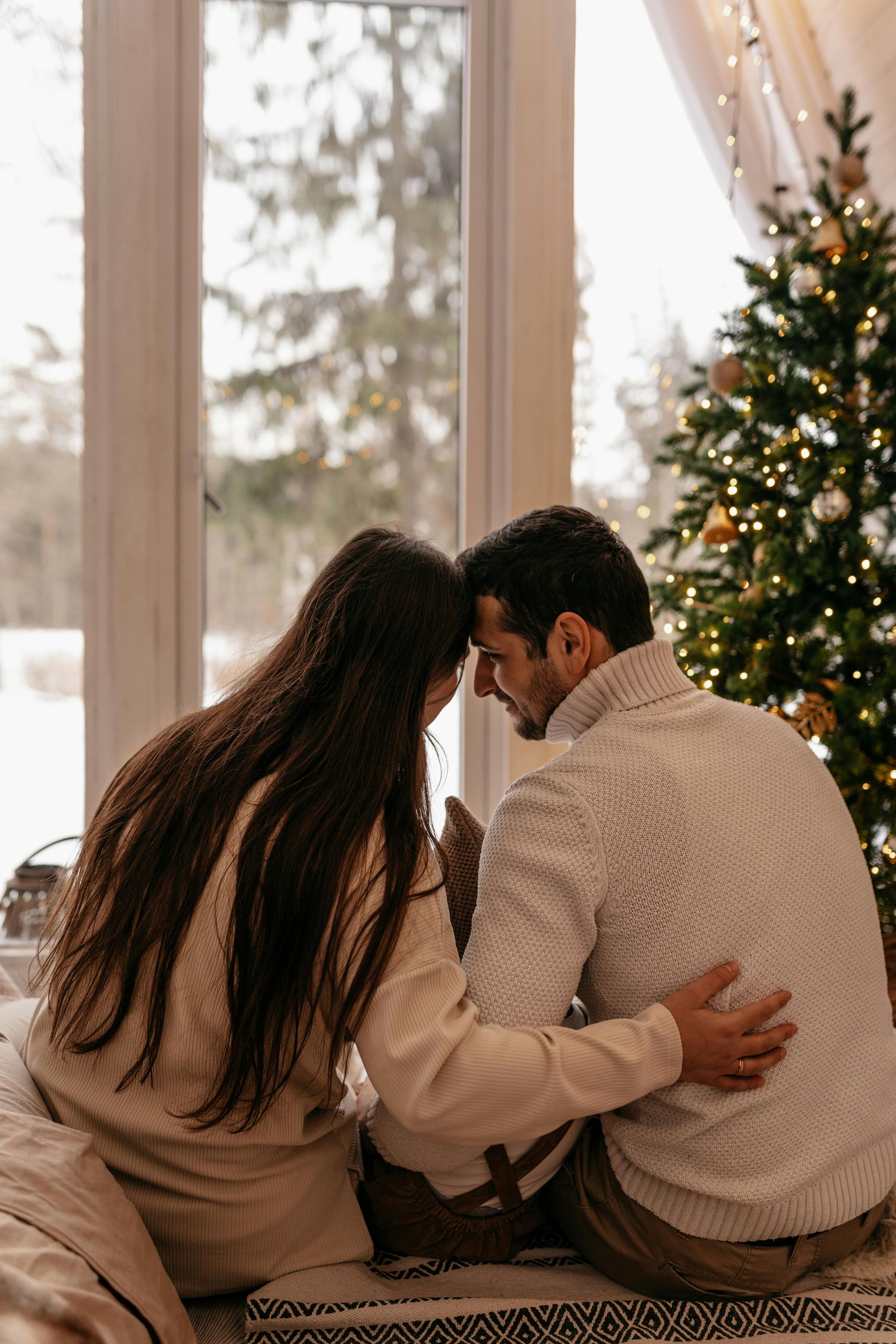 Glittery gold star surrounded by glowing string lights against a dark background.