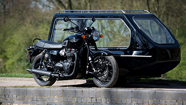 A black harley davidson motorcycle with a sidecar attached to it