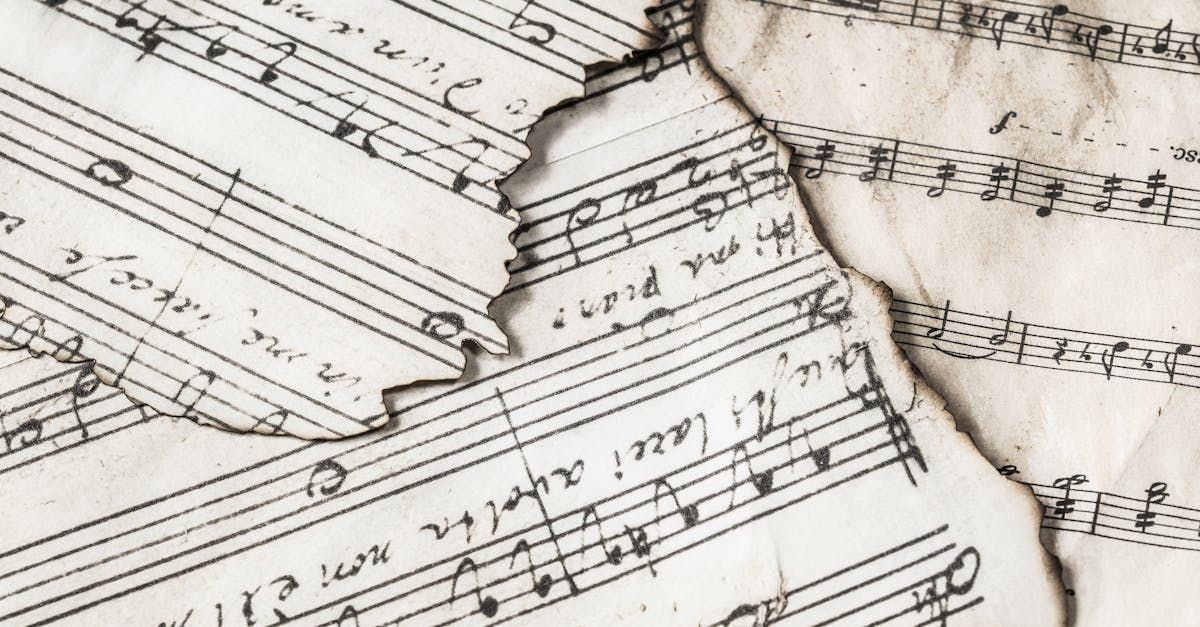 A close up of a piece of torn sheet music