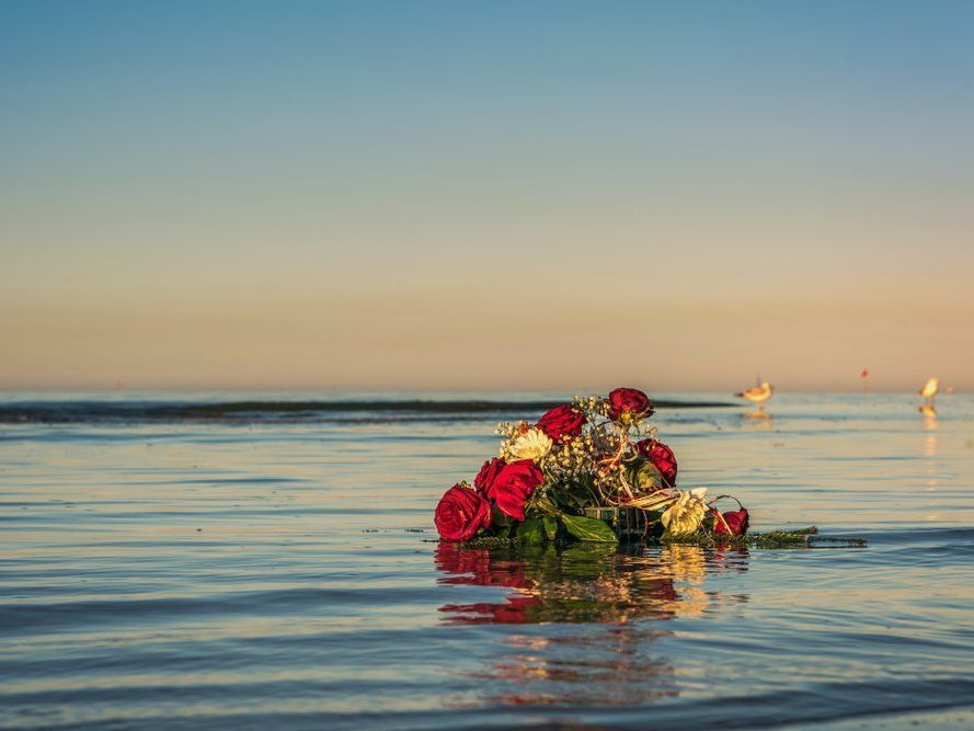 A bouquet of flowers is floating in the ocean