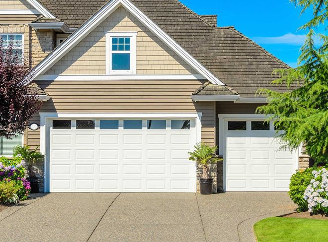Suburban house with white garage door