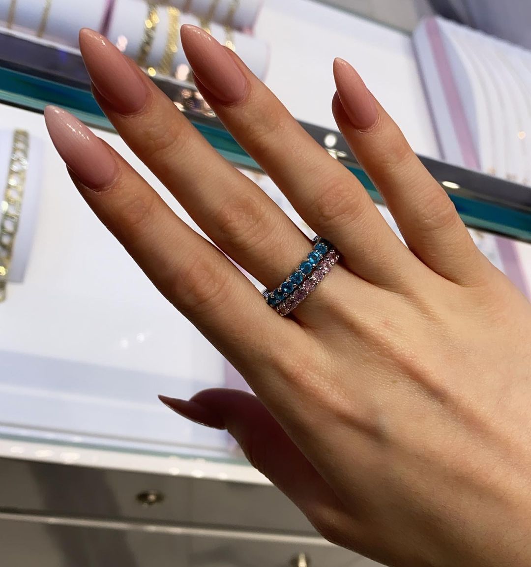 A close up of a woman 's hand with a ring on it