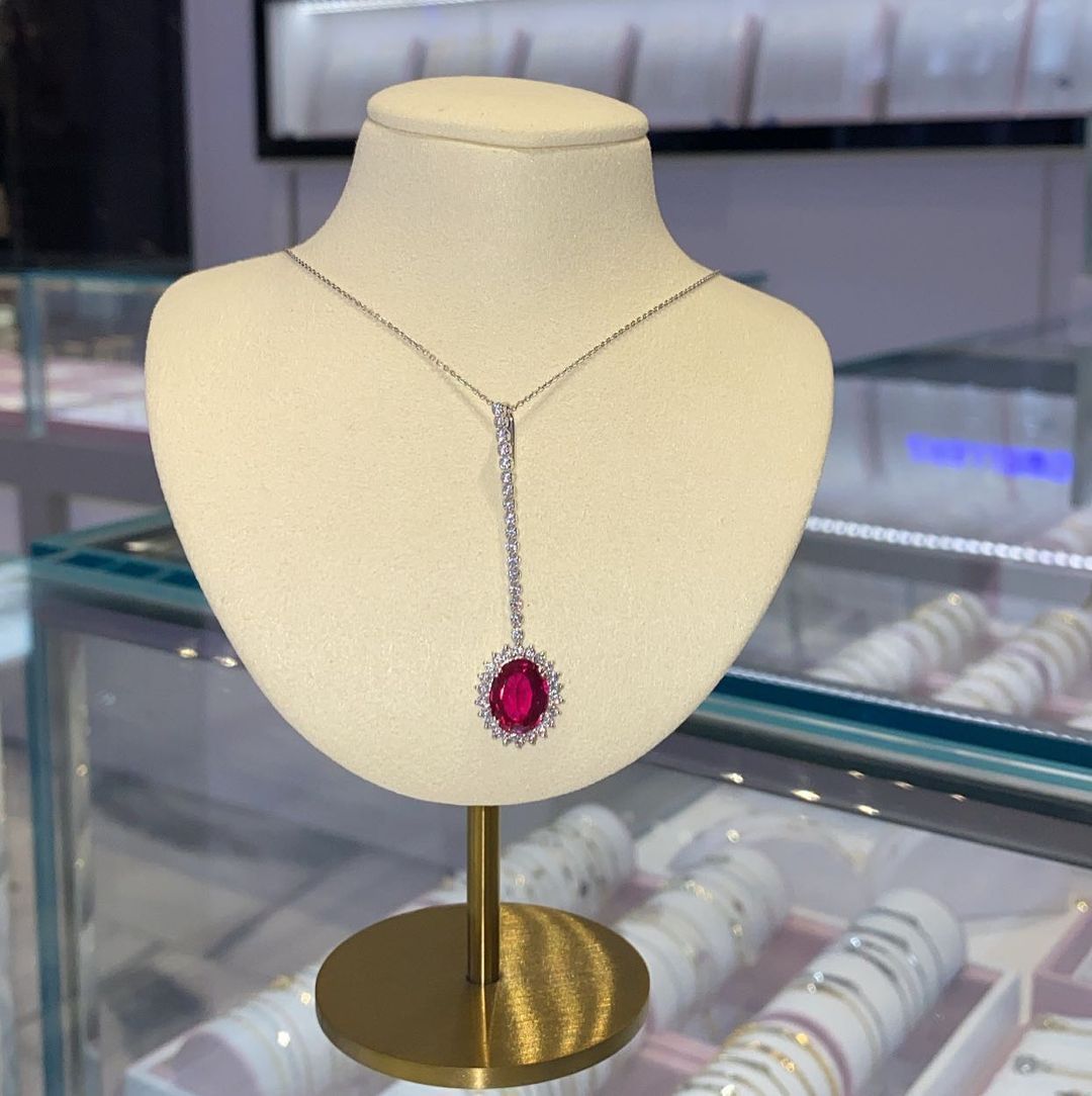 A necklace is on a mannequin in a store