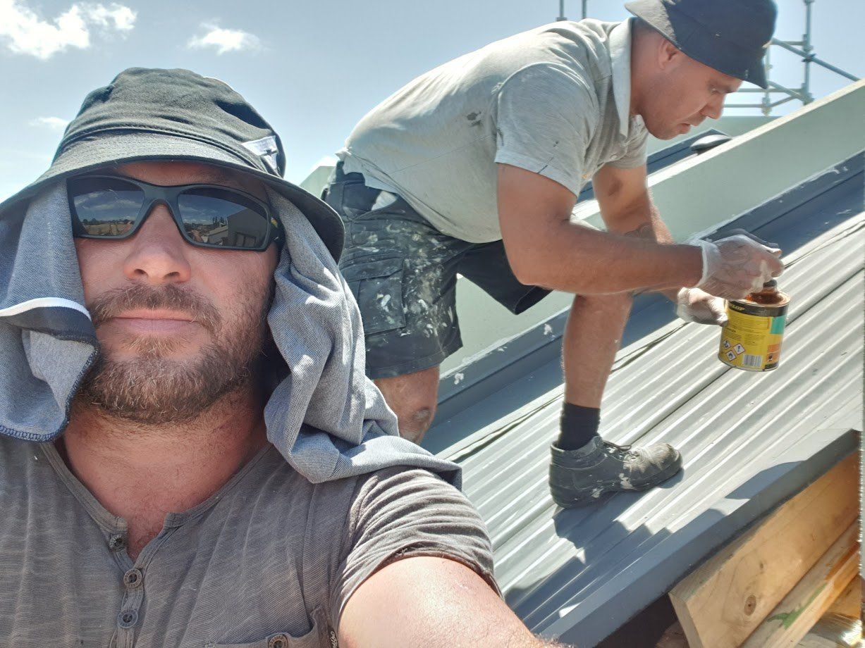 men working on roof