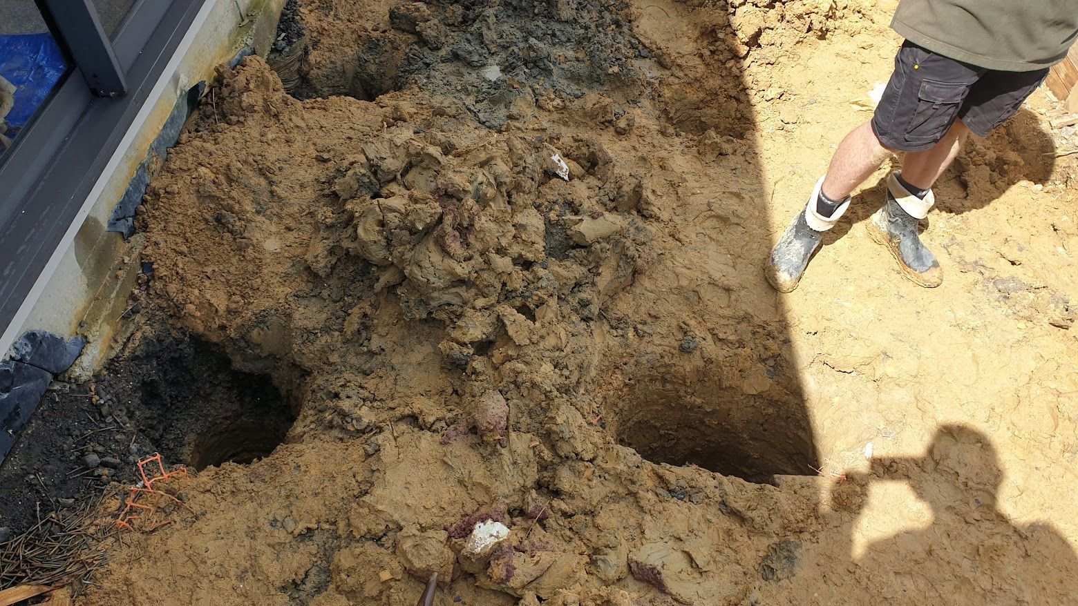 pile holes being drilled