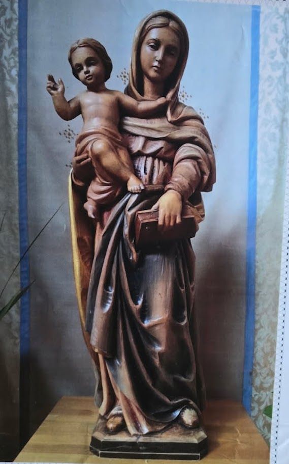 Fire-damaged church statue before restoration