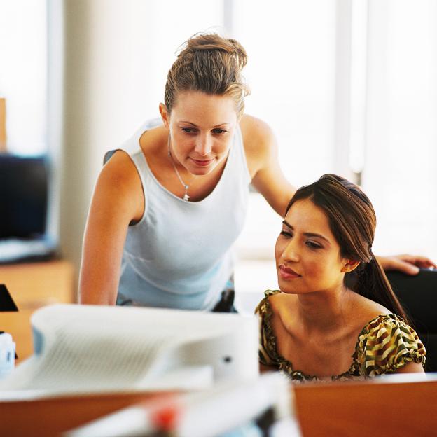 two ladies working in an office