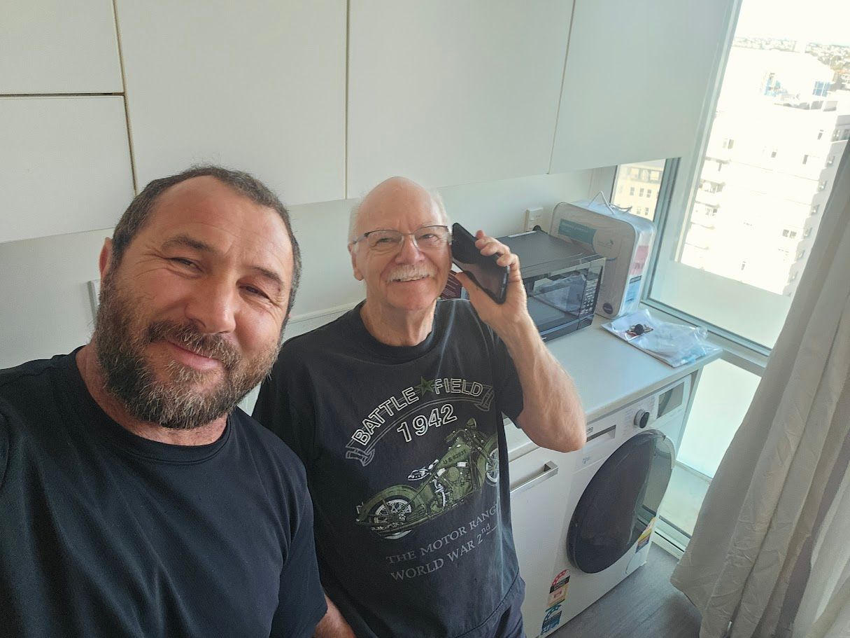 hinges being screwed to a piece of wood