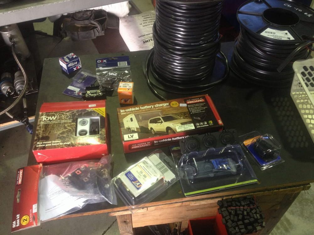 A Table With a Bunch of Items on It Including a Remote Control β Auto Electrical Solutions In Pialba, QLD