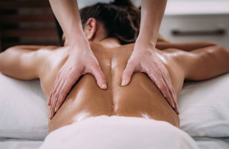A Woman Is Getting a Back Massage at A Spa — Mobile Massage on the Gold Coast, QLD