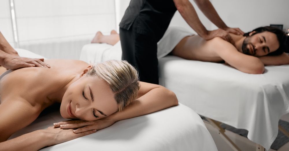 Beautiful Couple During Back Massage, Joint Day at Spa Salon — Relaxing Couples Massage on the Gold Coast, QLD
