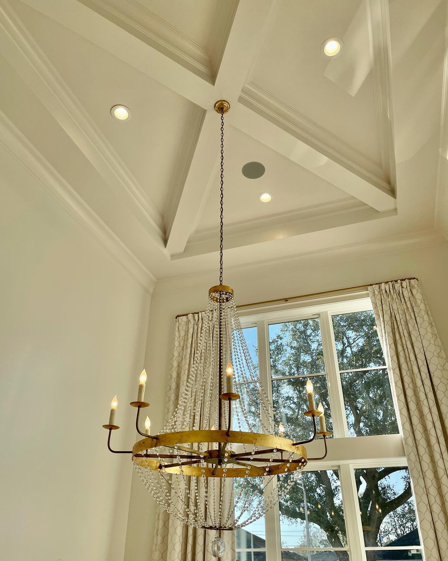 tall ceiling with gold chandelier