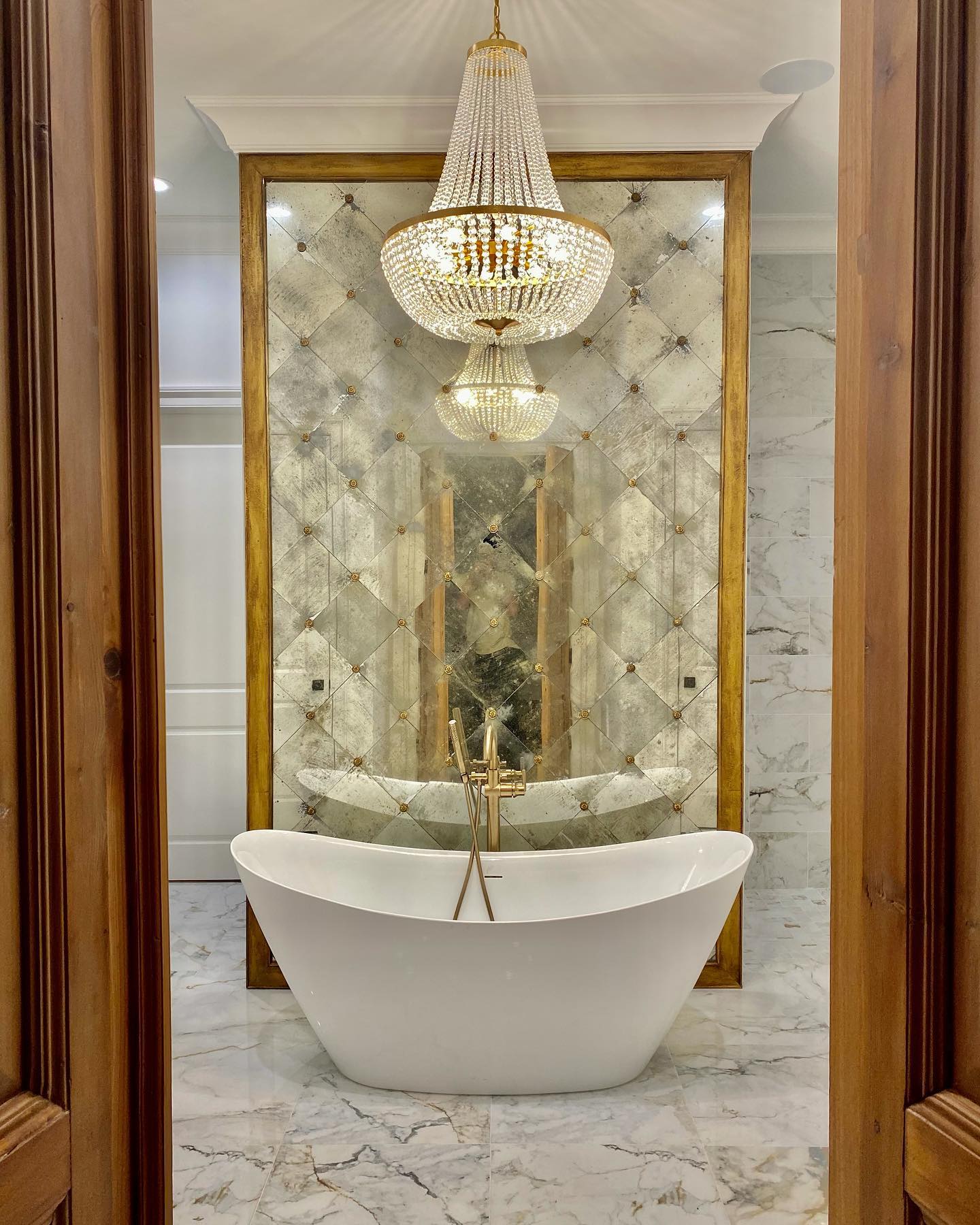 free standing tub with chandelier