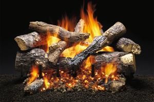 Burning fireplace with ceramic logs, flames, and embers on a dark surface.