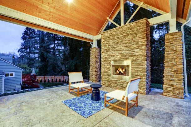 A patio with a built-in gas fireplace.