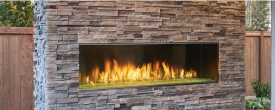 Modern horizontal fireplace with bright orange flames behind glass