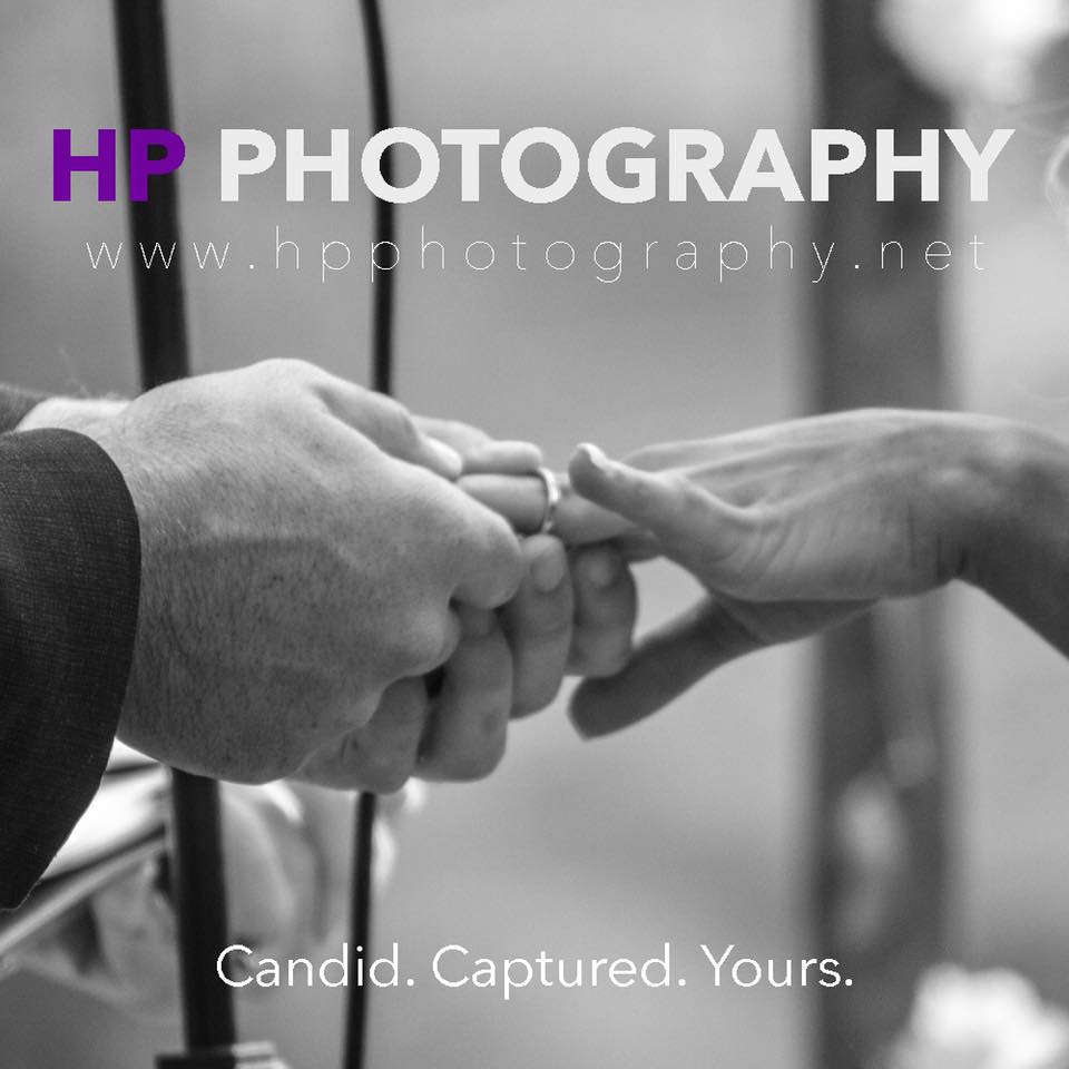 A man putting a wedding ring on a woman 's finger