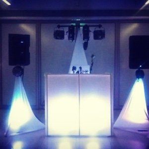 A dj booth with a lot of lights on it