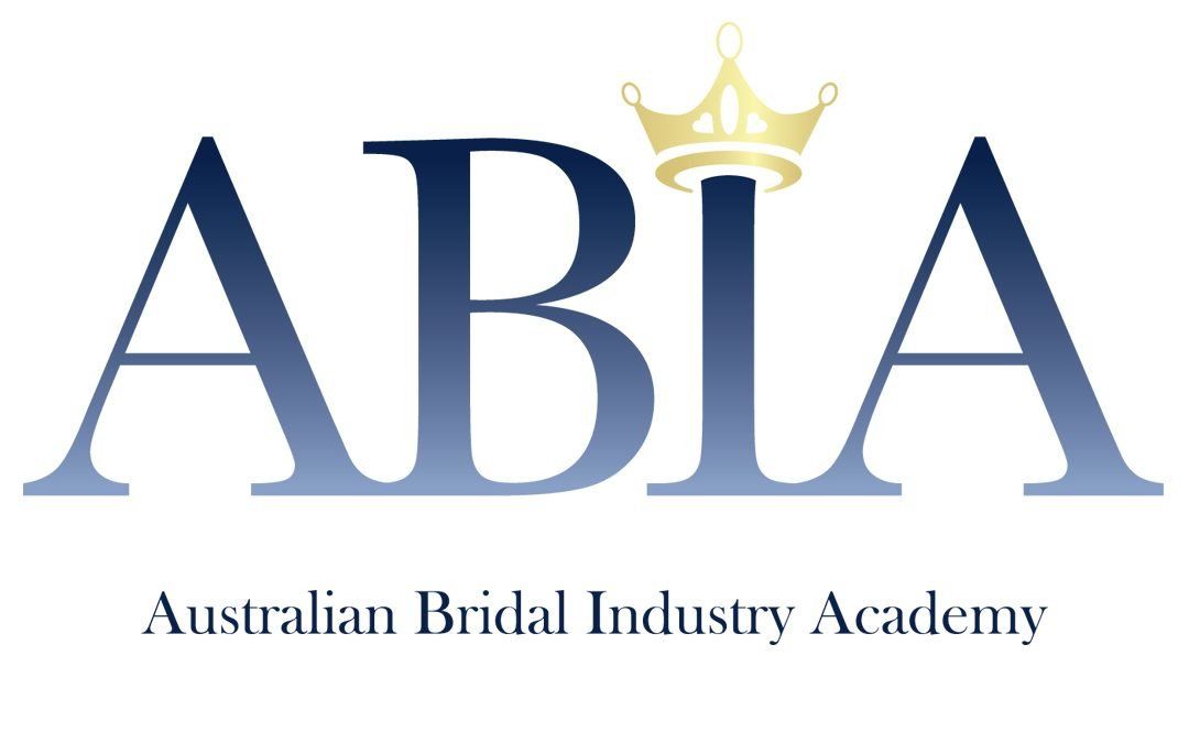 The logo for the australian bridal industry academy has a crown on it.