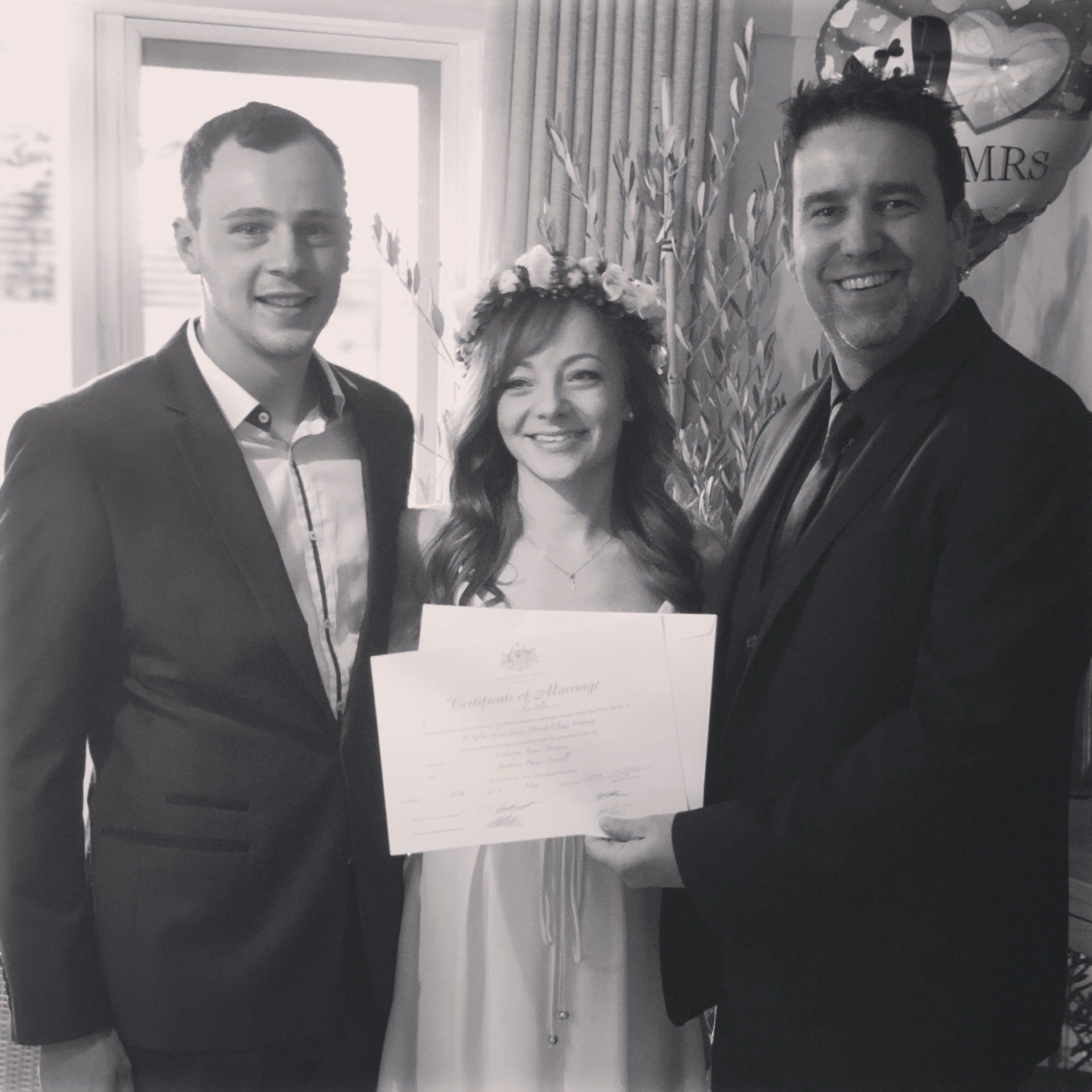 A black and white photo of a bride and groom posing for a picture
