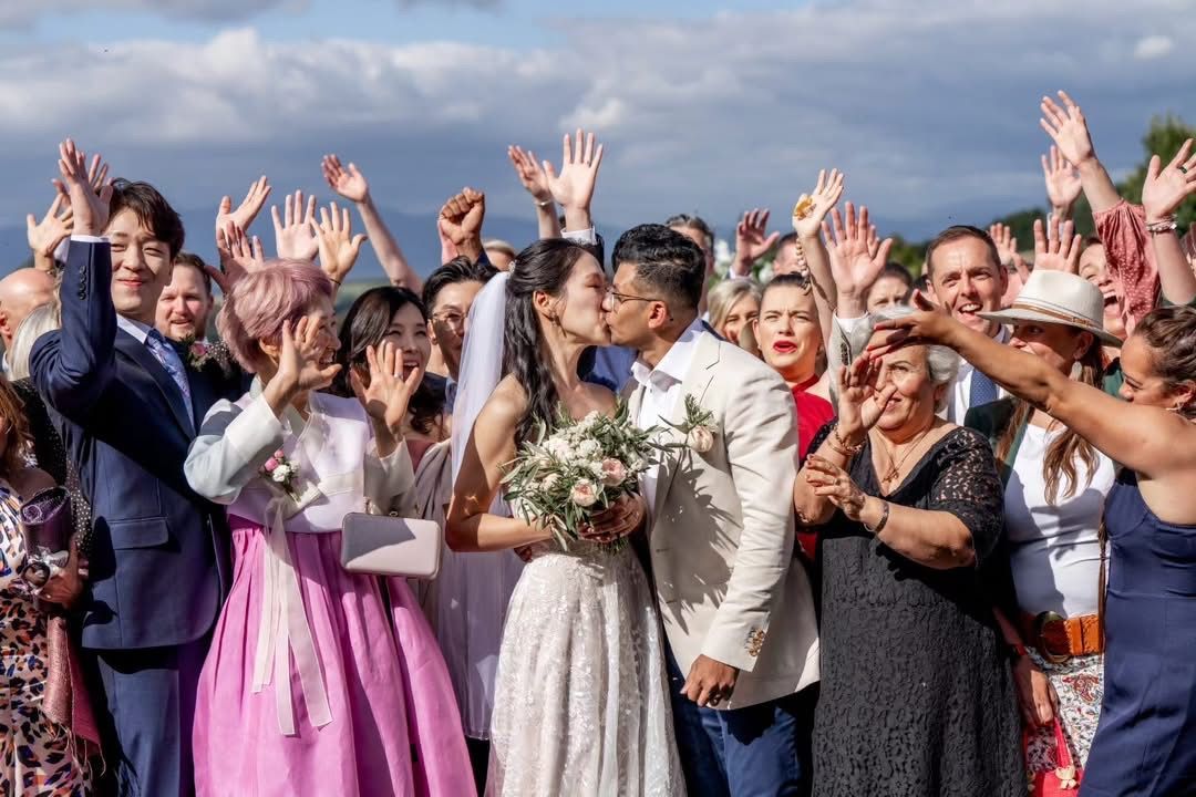 A bride and groom are laughing during their wedding ceremony.