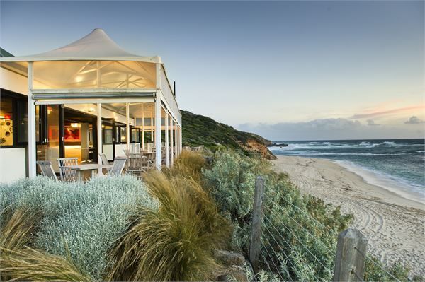 A house on a cliff overlooking the ocean