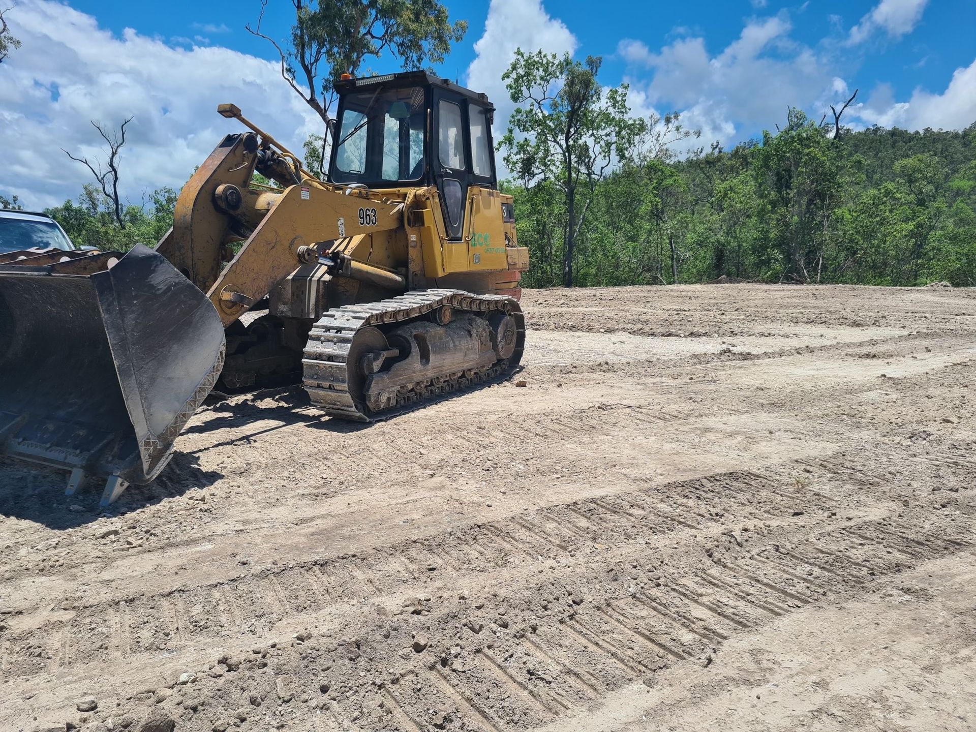 A Yellow Bulldozer On A Construction Site — Blue Dog Hire Qld In Midge Point, QLD