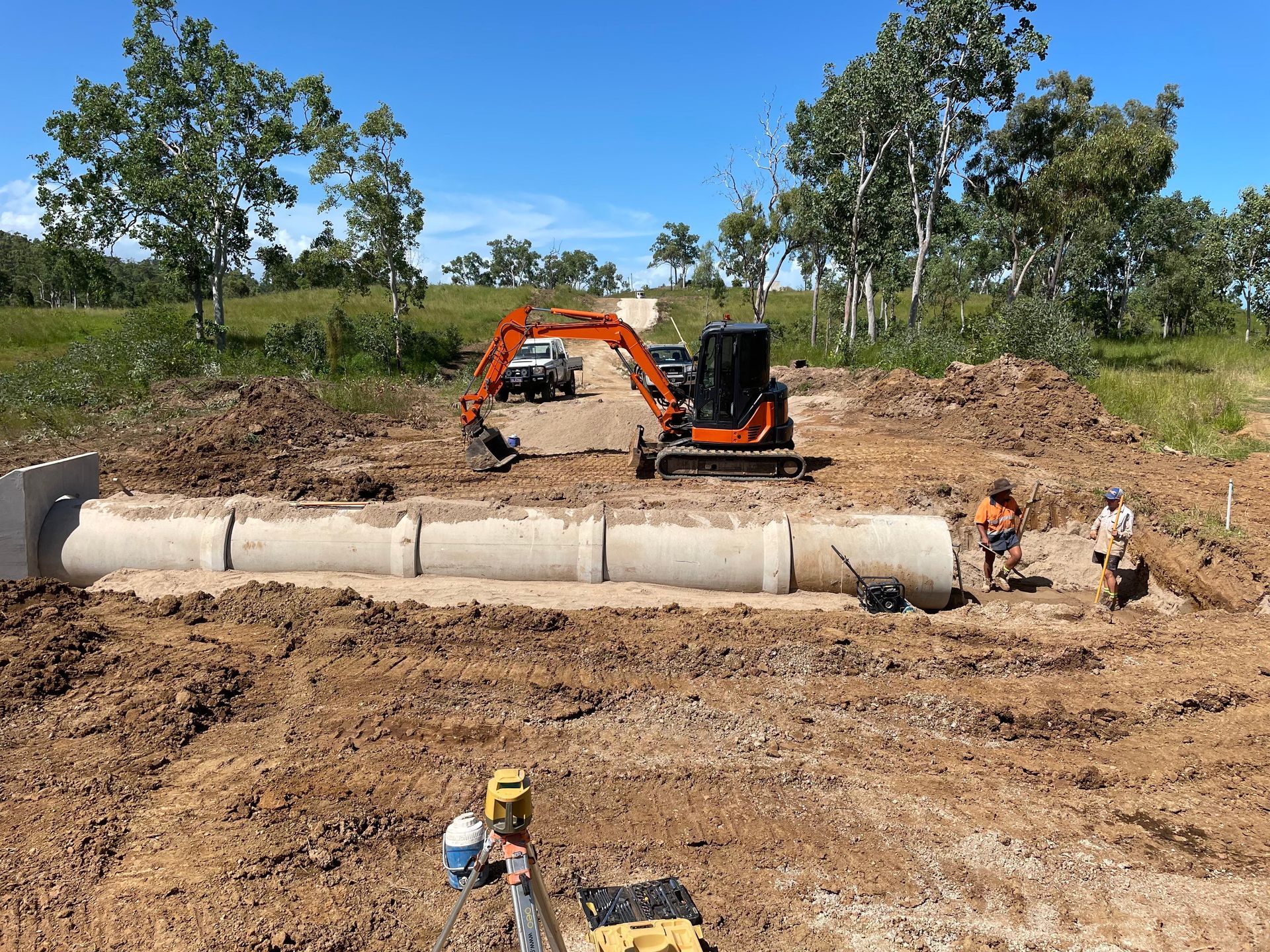 A Red Bobcat Moving Dirt On  A Construction Site — Blue Dog Hire Qld In Bowen, QLD