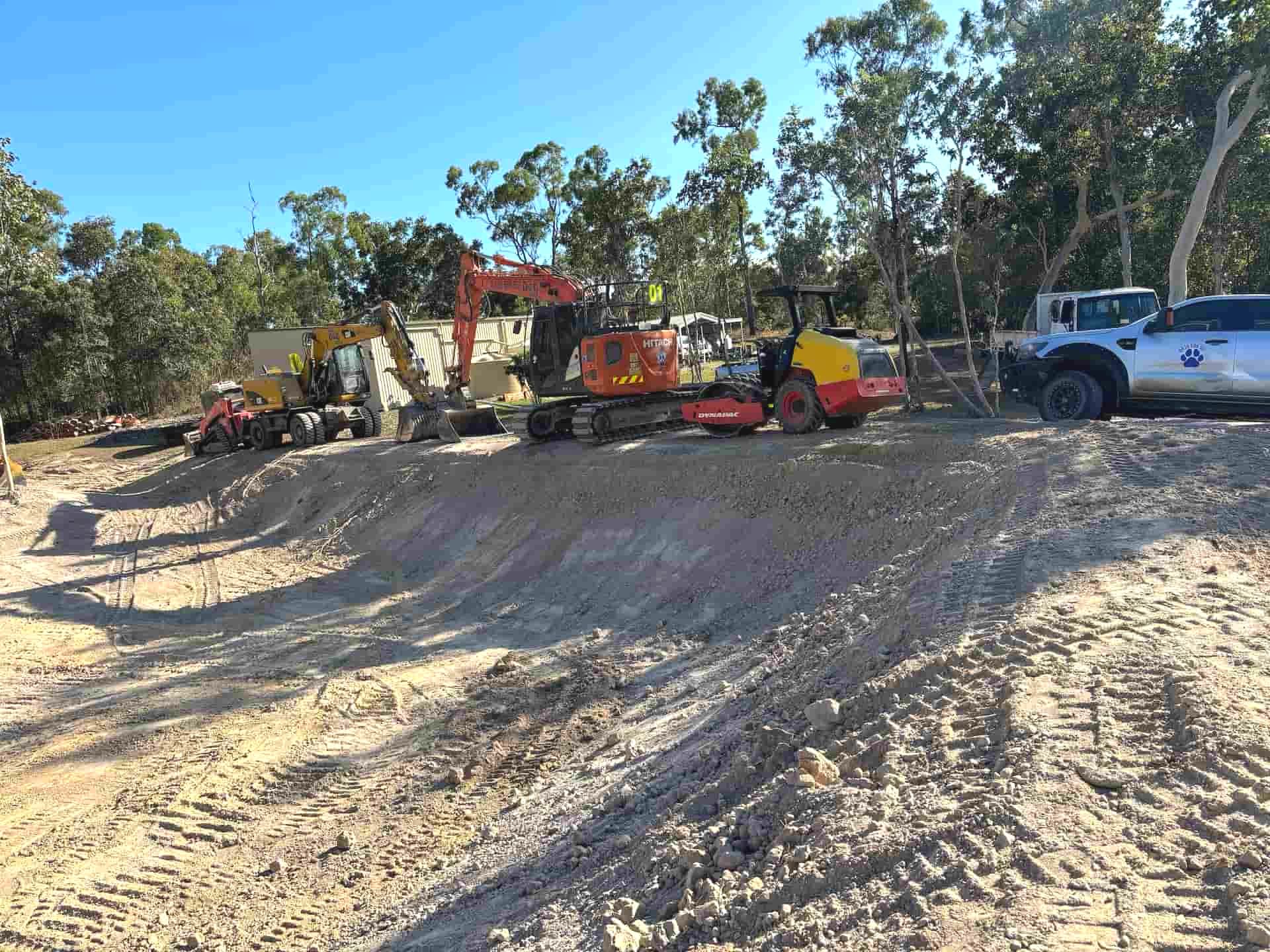 A Yellow Excavator On A Construction Site — Blue Dog Hire Qld In Cannonvale, QLD