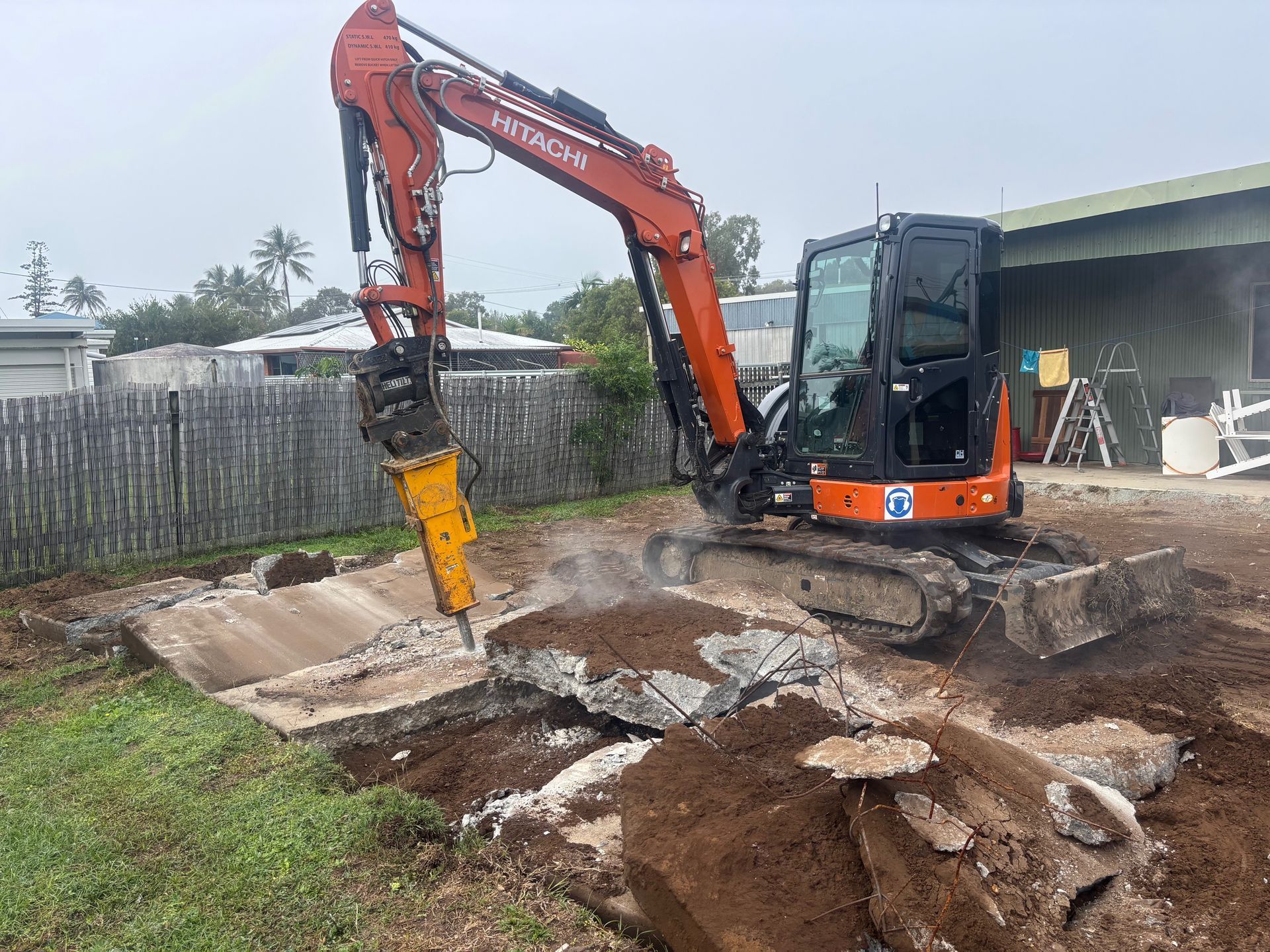 A Close Up Of A Tire On A Bulldozer On A Dirt Road — Blue Dog Hire Qld In Midge Point, QLD