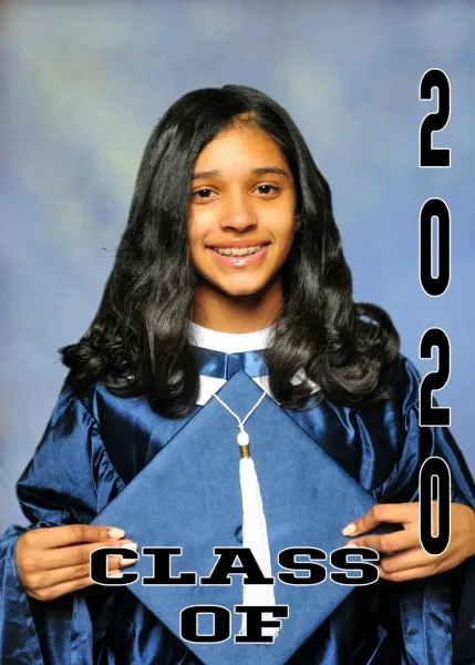 Young woman in blue graduation gown, holding cap, smiling. Class of 2020.