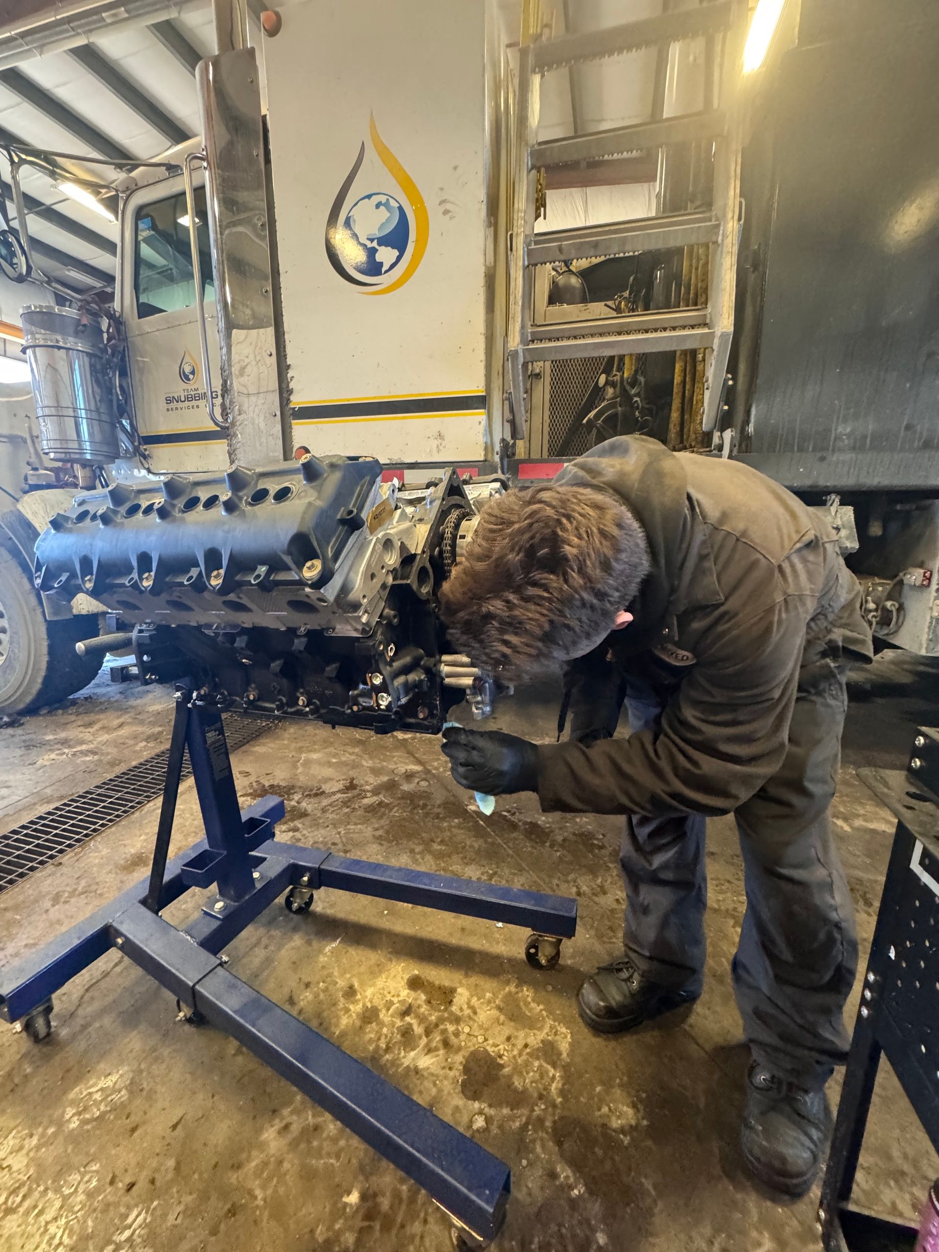Technician Inspecting Engine Block On Stand | Premixed Auto & HD Repair