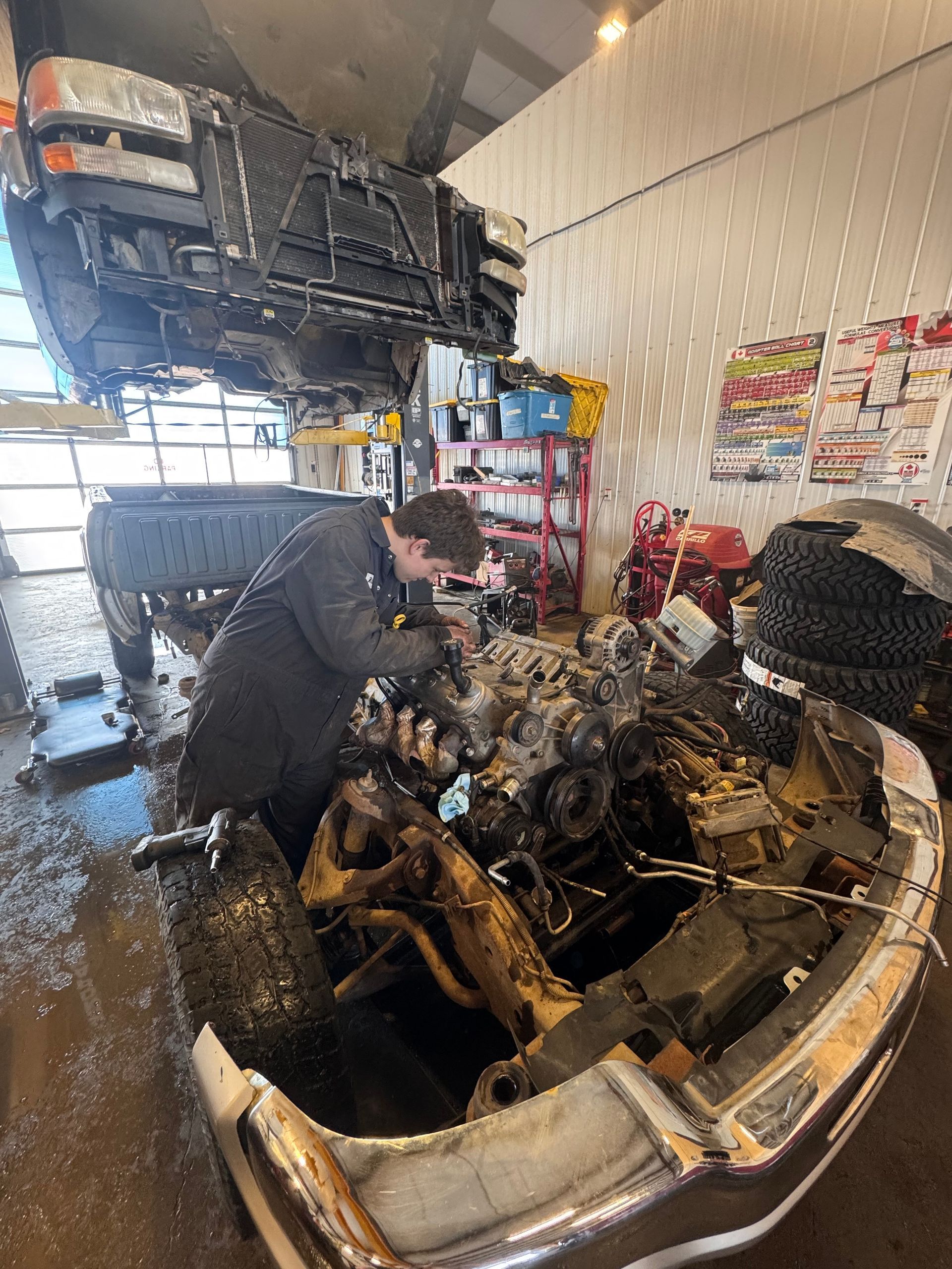 Mechanic Rebuilding Vehicle Engine Assembly | Premixed Auto & HD Repair