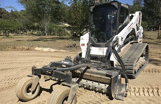 Bobcat with Harley rake