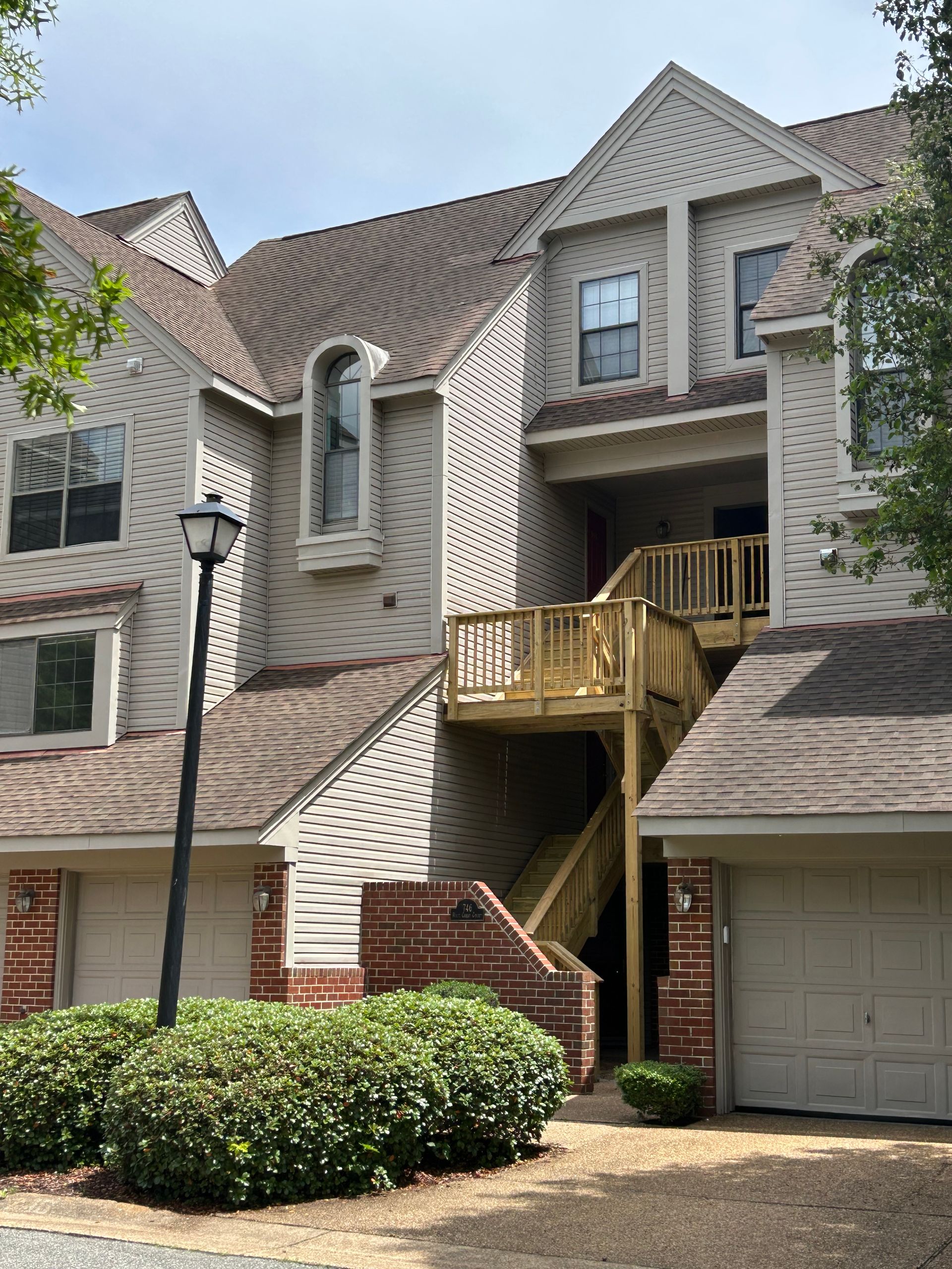 A large house with stairs leading up to the second floor