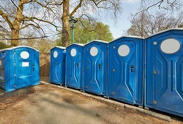 A Row of Blue Portable Toilets | Cheyenne, WY | Toilets On The Go, LLC