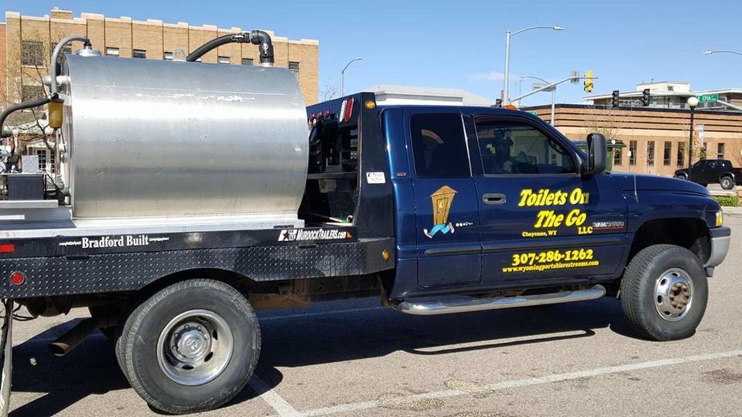 A Blue Truck That Says Talking on the Go is Parked in a Parking Lot | Cheyenne, WY | Toilets On The Go, LLC