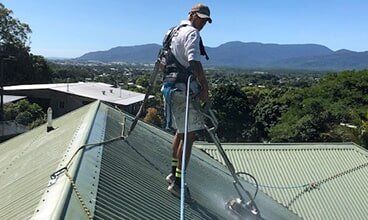 Man on roof — Painting  Services in Cairns, QLD