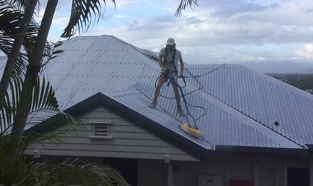 Man on roof — Painting  Services in Cairns, QLD
