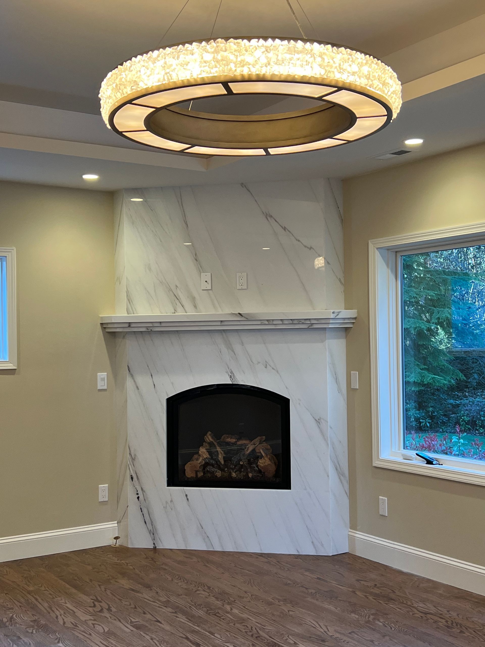 Polished marble fireplace with floating marble shelf