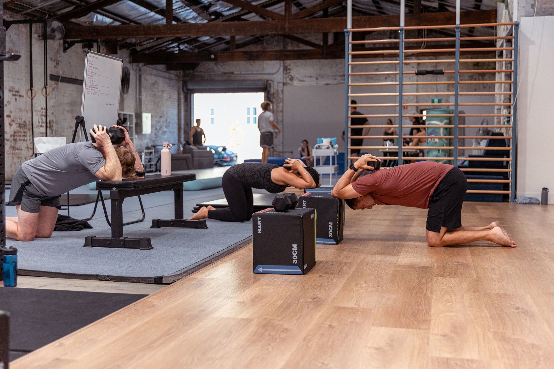 Image of people stretching in the gym