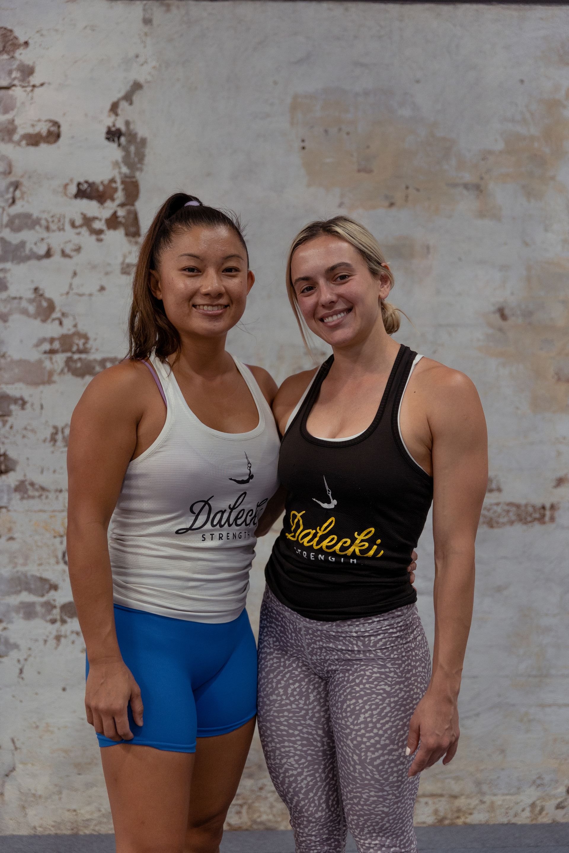 Image of two girls posing for picture in the gym