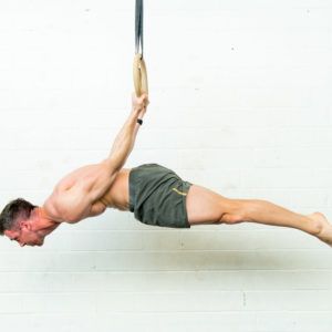 Image of a guy doing gymnastics on a ring