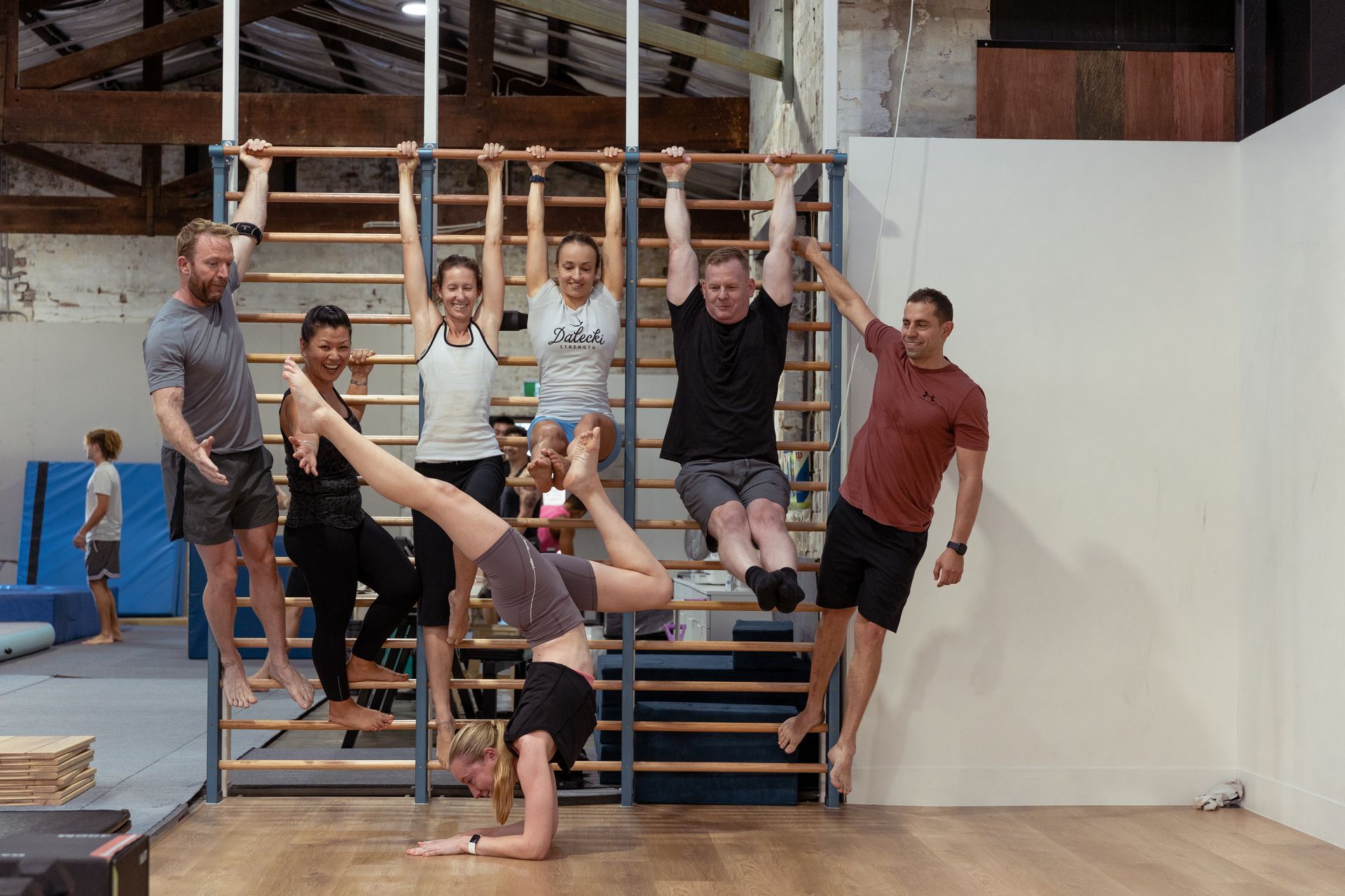 Image of people posing for a picture in the gym