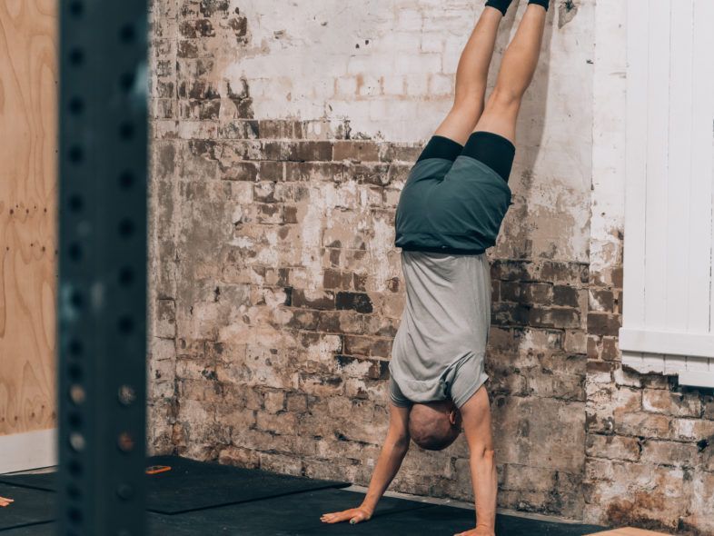 Image of a guy doing handstand